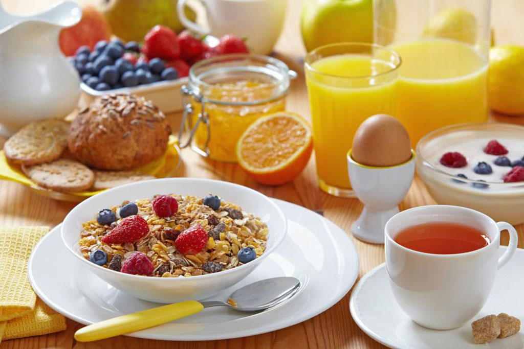 Breakfast spread with berries and eggs